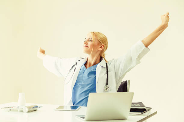istock Relaxed doctor taking a break in hospital office. 1037184632