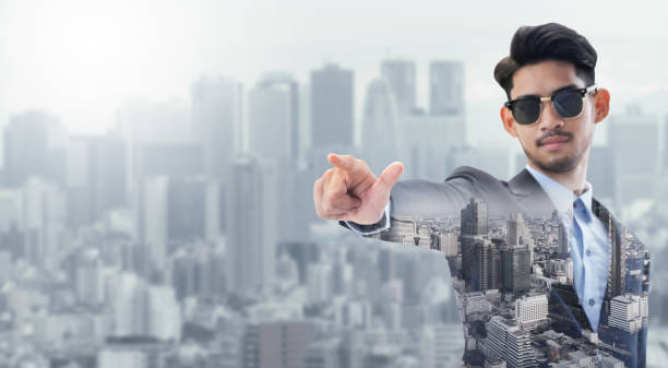 istock Double exposure businessman pointing at copy space 1037188322