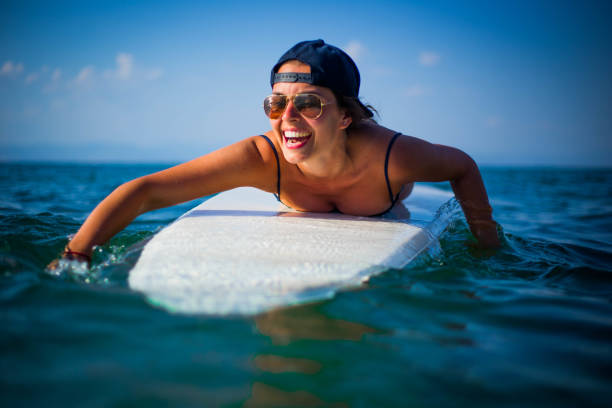 istock A woman on a surfboard 1037189318