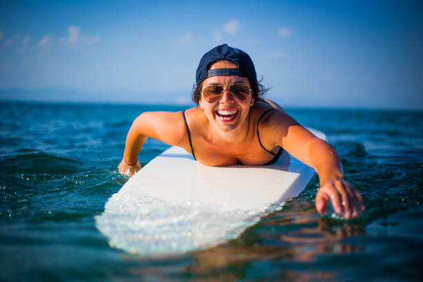 istock Woman preparing to surf 1037189330