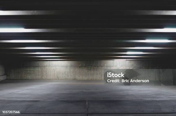 A Big Empty Parking Garage Under The Lights Stock Photo - Download Image Now - Parking Lot, Parking, Parking Garage