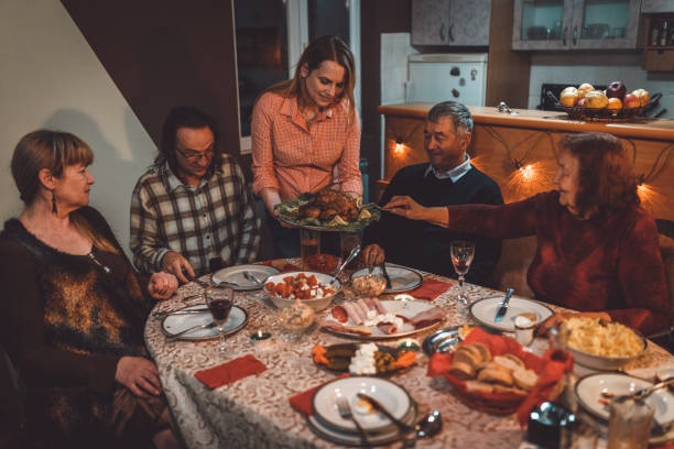istock Multi-generational family celebrating thanksgiving at home 1037216502