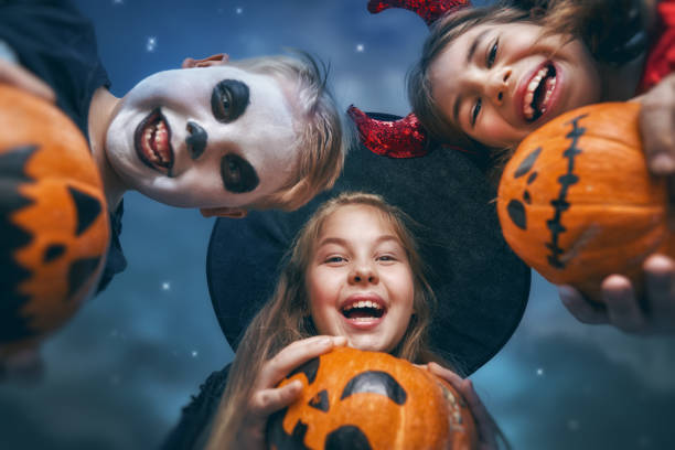 laughing children in witches costumes. - halloween witchs hat witch autumn imagens e fotografias de stock