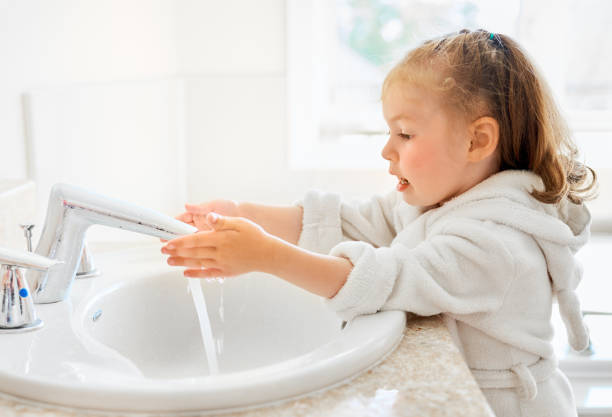 girl is washing hands