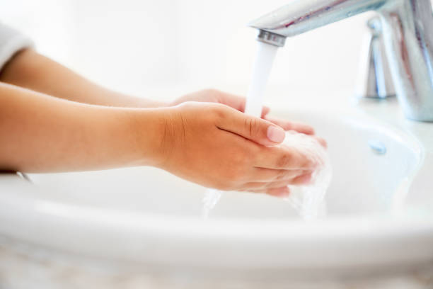 istock girl is washing hands 1037250074