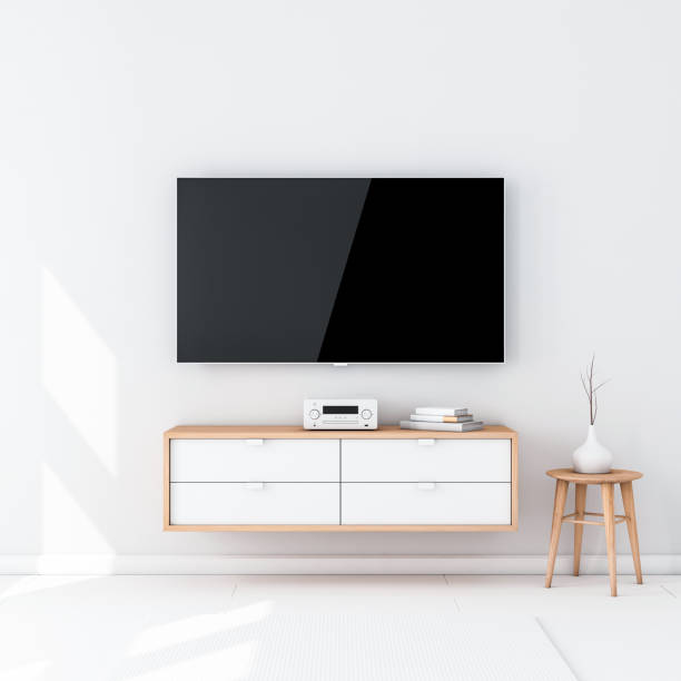 istock Smart Tv Set Mockup with black screen hanging on the wall in modern interior 1037261246