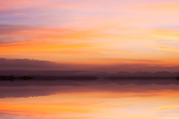 istock bright orange sky and light of the sunset background. 1037265144