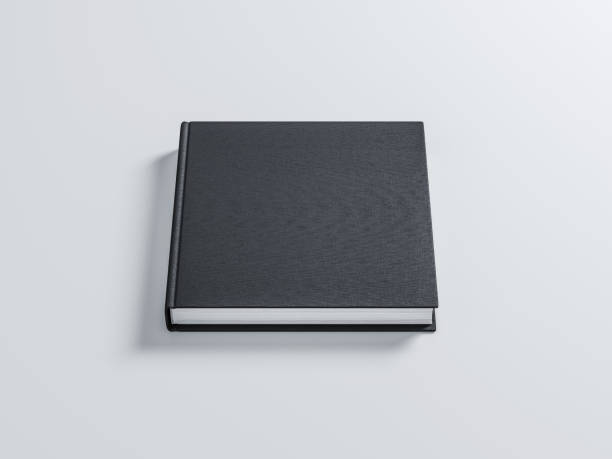 istock Black Book with textured hard cover Mockup in gray studio 1037276134