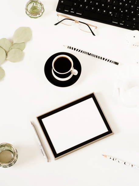 istock Creative home office desk workspace, composition mock up,  cup of coffee, keyboard, blanket,  eucalyptus branches, different subjects on white background. Flat lay, top view.Copy space. 1037296442