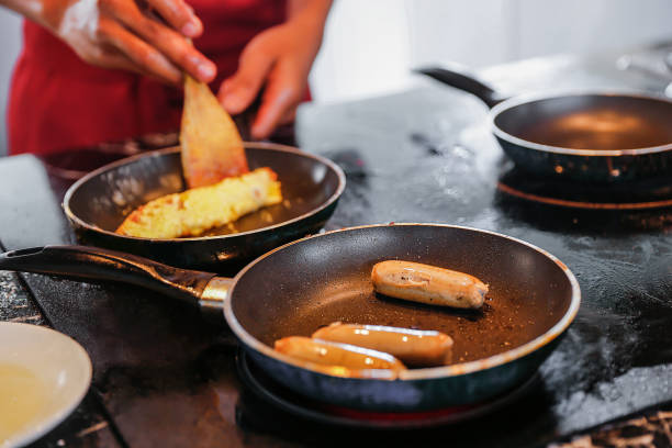 istock Focus on fried chicken sausage on frying pan 1037311998