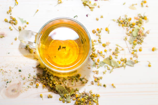 istock Glass cup with fresh herbal tea 1037324522