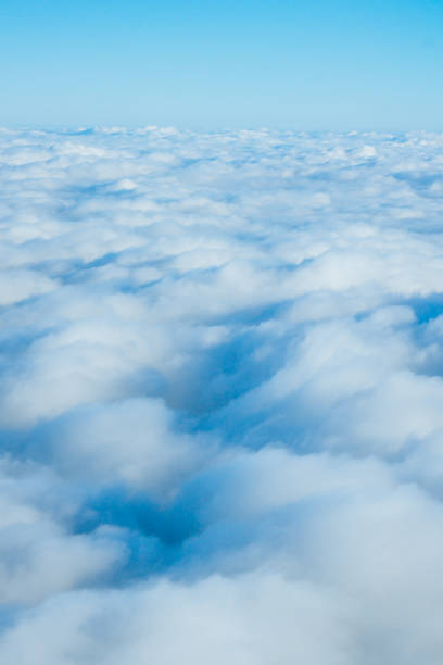 istock clouds from airplane window. View of the sky above the clouds 1037327184