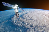 Research, probing, monitoring hurricane Florence raging on the coast. Satellite above the Earth makes measurements of the weather parameters. Elements of this image furnished by NASA.