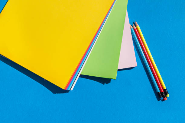 istock Sheets of colored papers and pencils - color palette 1037361688