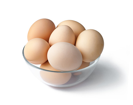 Eggs in a bowl isolated on white background