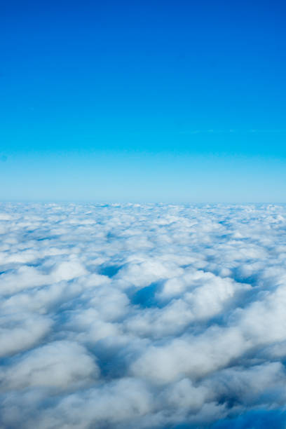 istock clouds from airplane window. View of the sky above the clouds 1037366706