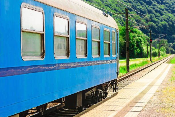 istock Blue rail wagon waits at the platform for passengers 1037370268