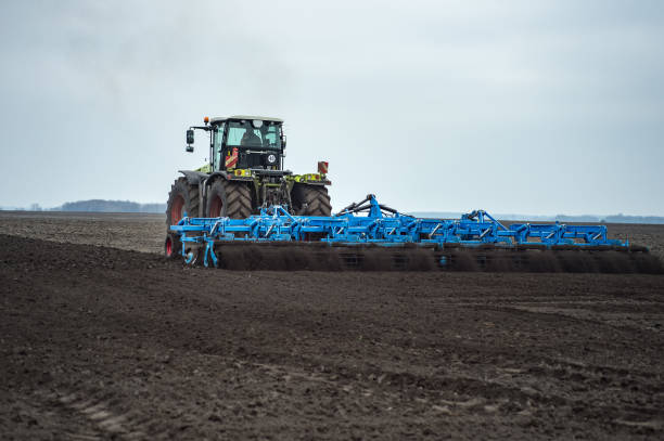 istock Land cultivation with tractor and seedbed cultivator 1037370350
