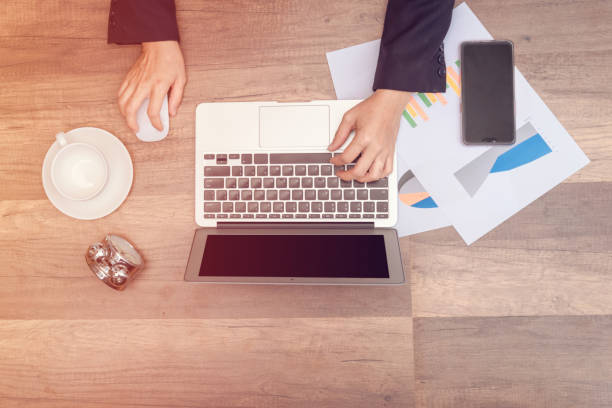 istock business man holding hand on wooden table 1037372170