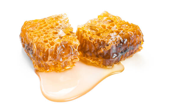 istock honey with honeycomb isolated on white background 1037374902