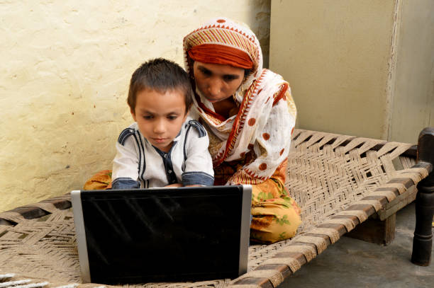 istock Family using laptop at home 1037377354