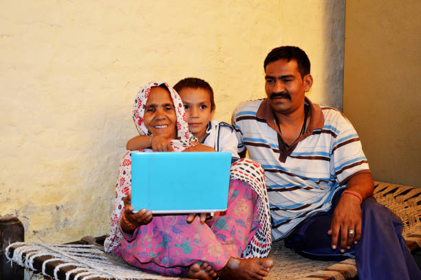 istock Family using laptop at home 1037377792
