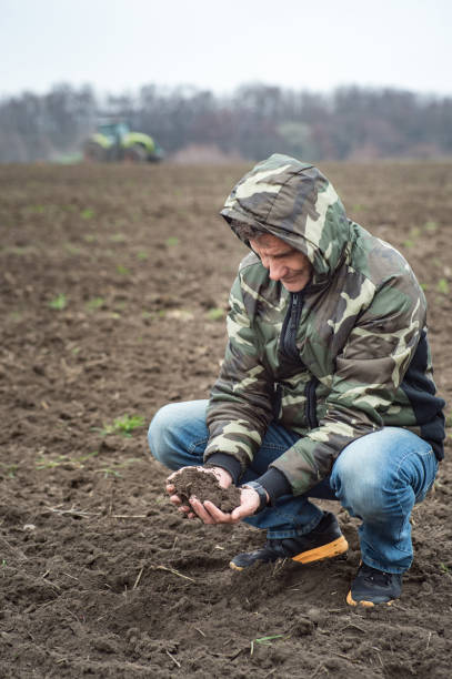 istock agronomist checks the soil moisture before sowing cereals 1037379024