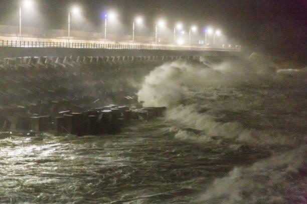 istock Big rough waves creashing into coastline during typhoon storm 1037389724