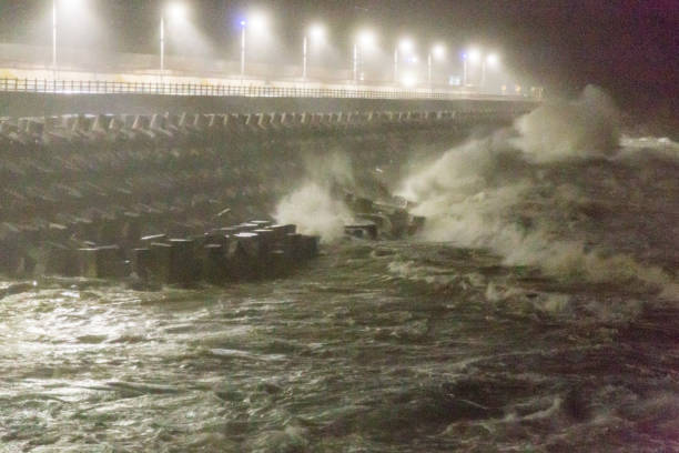 istock Big rough waves creashing into coastline during typhoon storm 1037389882