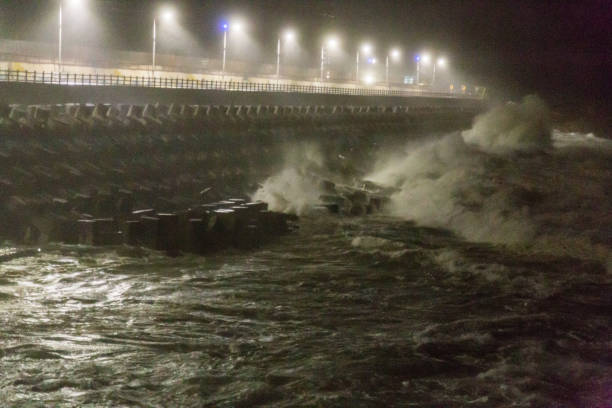 istock Big rough waves creashing into coastline during typhoon storm 1037390006