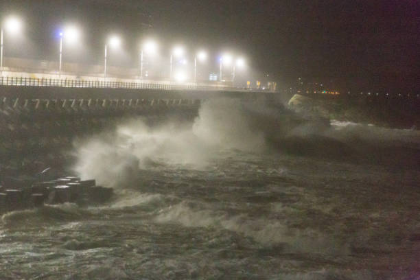 istock Big rough waves creashing into coastline during typhoon storm 1037390080
