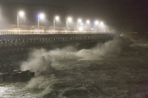 istock Big rough waves creashing into coastline during typhoon storm 1037390370