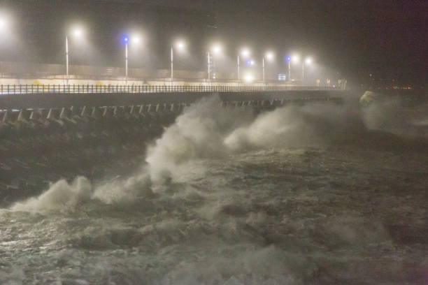 istock Big rough waves creashing into coastline during typhoon storm 1037390562