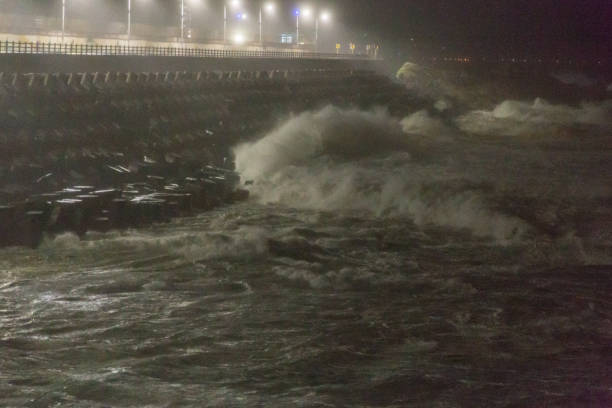 istock Big rough waves creashing into coastline during typhoon storm 1037391044
