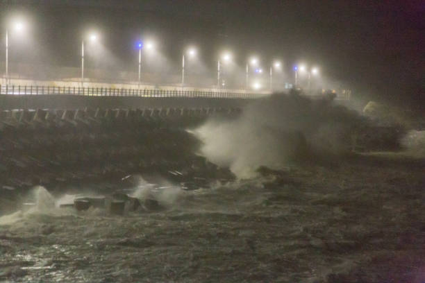 istock Big rough waves creashing into coastline during typhoon storm 1037391676