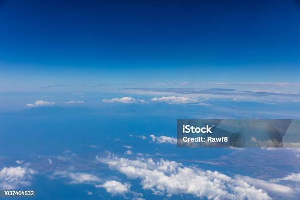 Cloudscape Background View Out Of An Airplane Window Stock Photo - Download Image Now