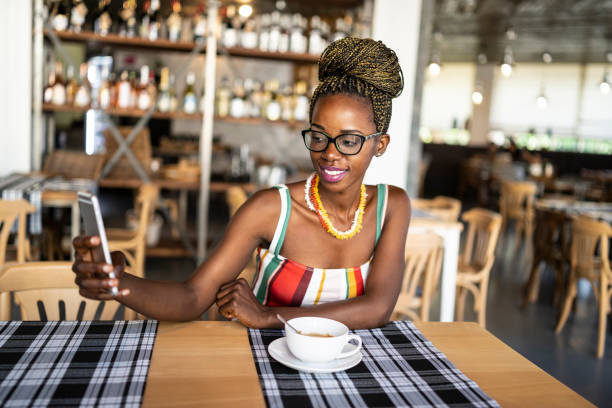 istock African woman drinking coffee 1037405970