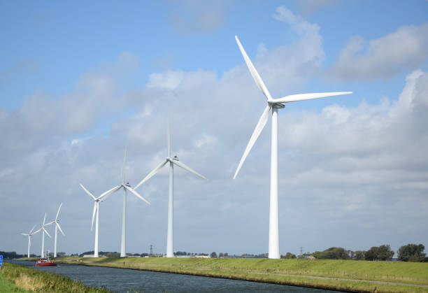 Wind turbines in Holland Wind turbines in Holland kanal stock pictures, royalty-free photos & images