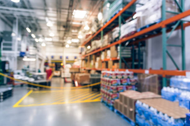 istock Filtered tone blurry background worker stack goods on forklifts at wholesale store in USA 1037416678