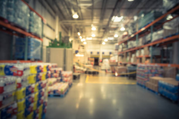 istock Filtered tone blurry background worker stack goods on forklifts at wholesale store in USA 1037416724