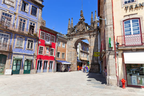 Braga, Portugal - July 27, 2017: Arco da Porta Nova Gate. A Baroque Monumental Arch built in the 18th century to be the main city gate and a landmark of the city.
