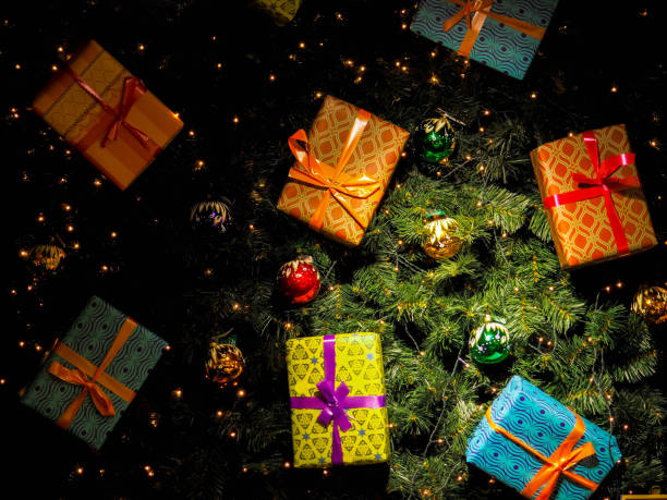 istock Christmas gift box. presents in front of a festive background. 1037421888