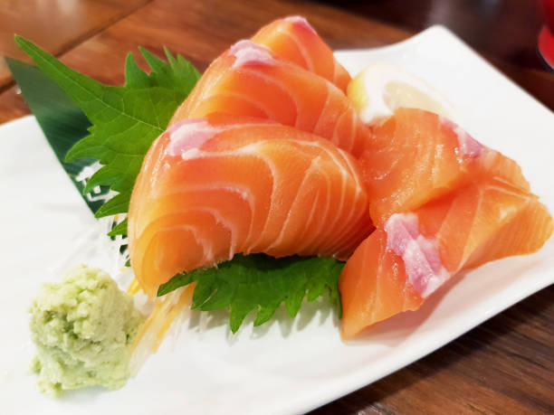 istock Salmon raw sashimi on brown Japanese traditional dish 1037435838