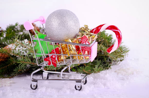 istock Christmas decoration in mini shopping trolley 1037474016
