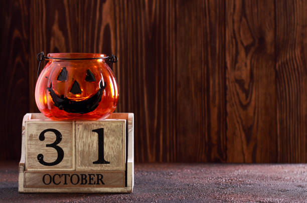 istock Halloween background - calendar and decorative pumpkin 1037476896