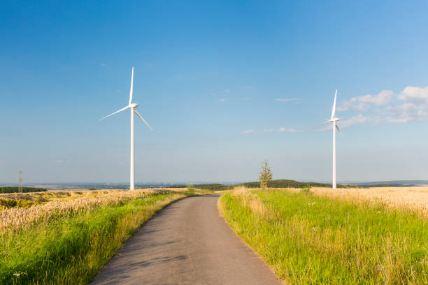 istock Road Leading To Wind Turbines 1037479930