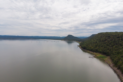 Drone shot Aerial view landscape scenic of big river reservoir dam with nature forest and mountains in tropical land