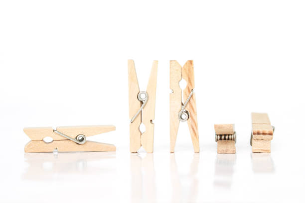 istock wooden clothes pin on white background. 1037483966