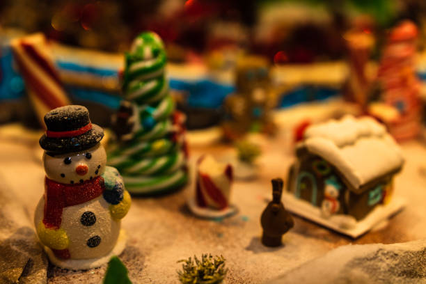 istock Christmas decorations against blurred background. Ginger houses with candies. 1037484408