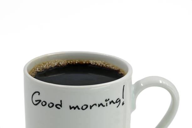 istock close up of ceramic mug with coffee, Good Morning, on white background 1037488498